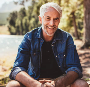 A Mature man smiling in photo