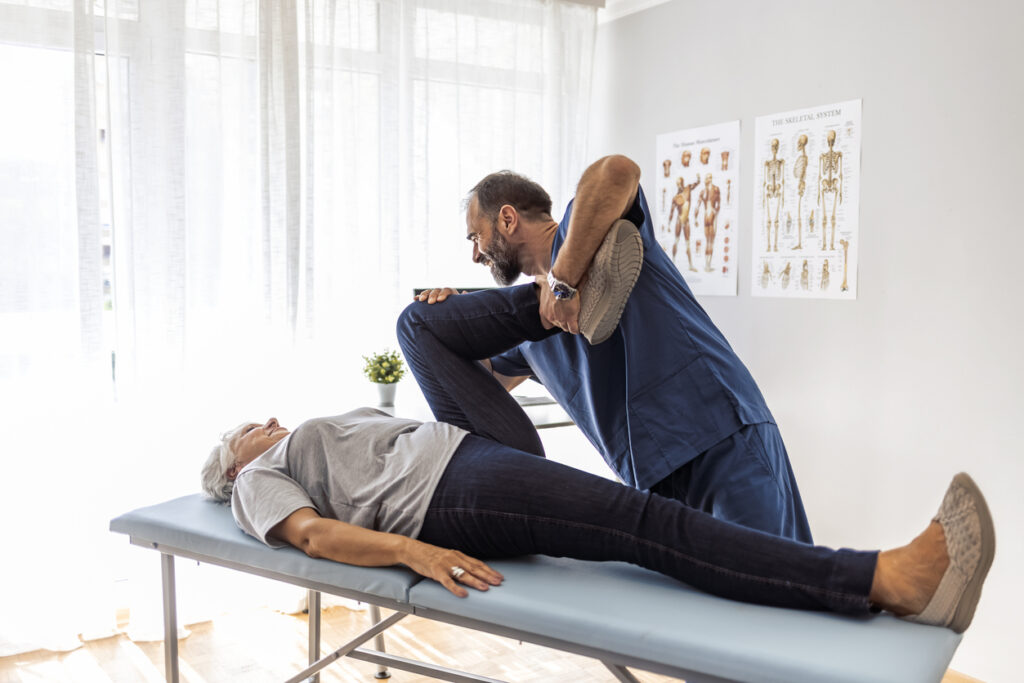 A woman getting chiropractor getting treatment